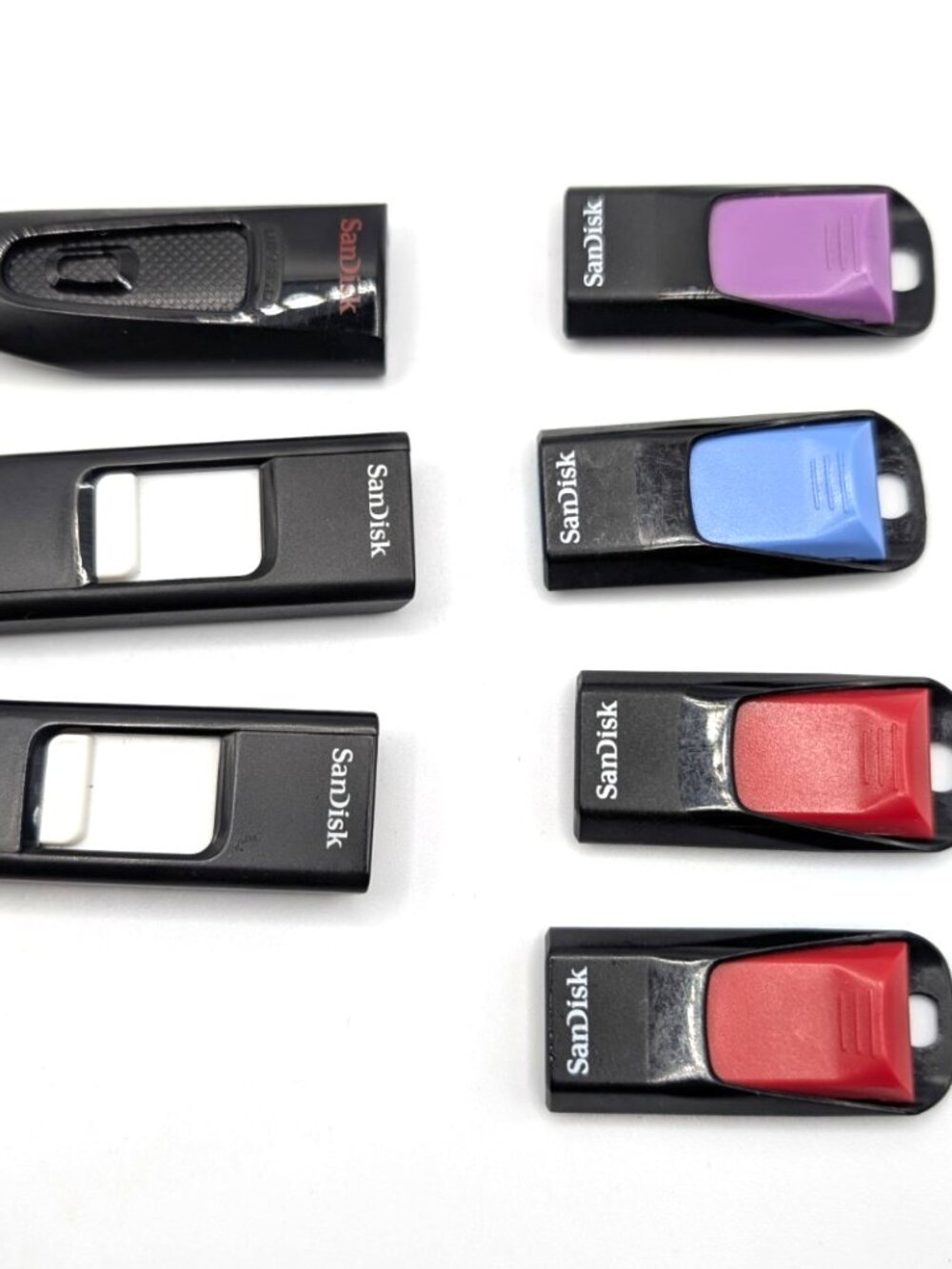 Lot of 7 SanDisk Memory Stick Thumb Drives 6 x 4GB + 1 x 32GB Formatted Tested